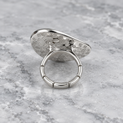 Underside view of Pearl Petal adjustable ring showing segmented band construction
