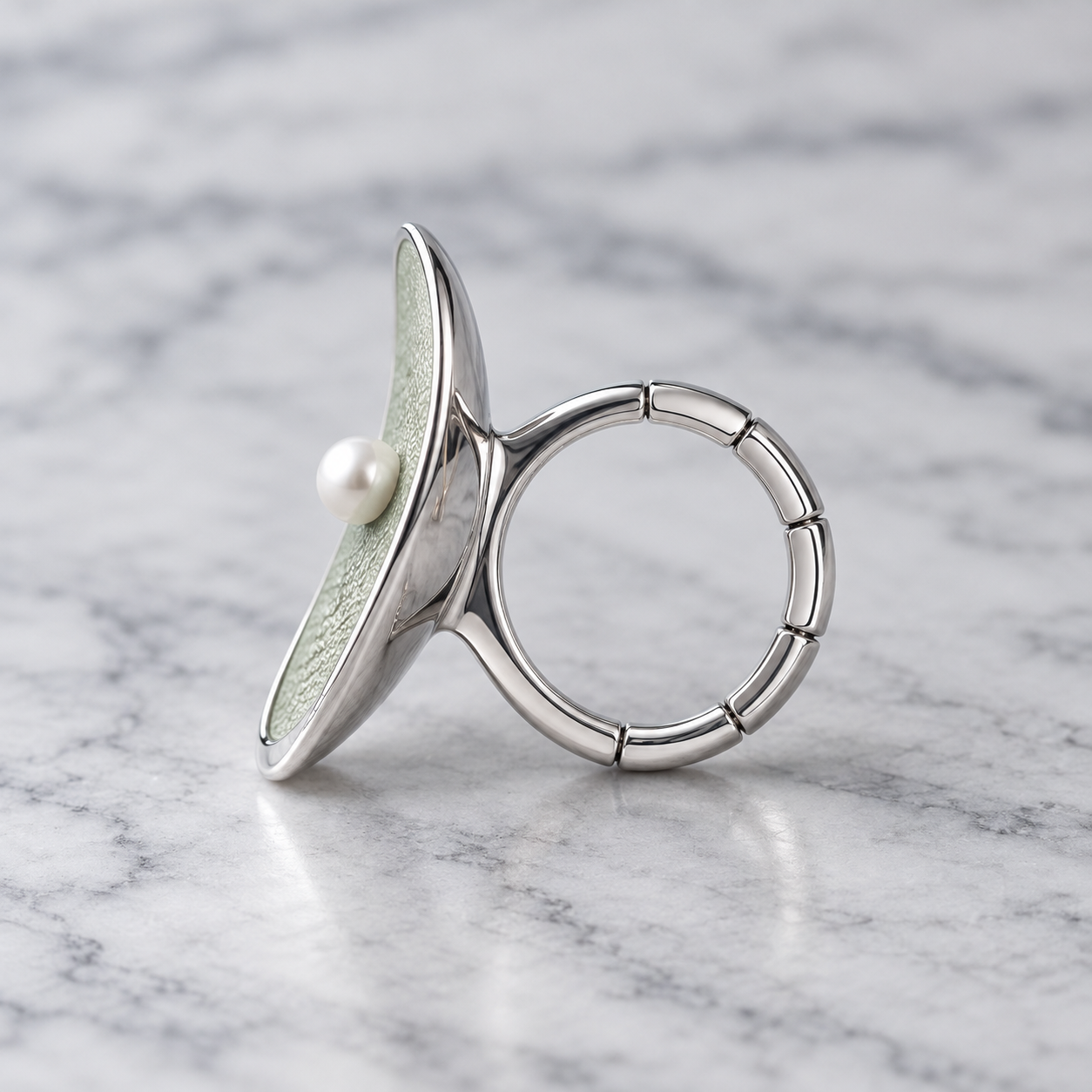 Side profile of Pearl Petal adjustable ring showing segmented flexible band
