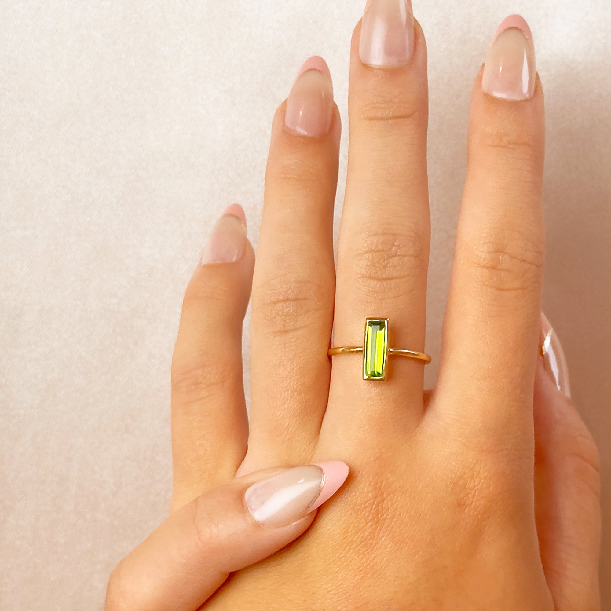 peridot-august-small-baguette-adira-ring-model.jpg