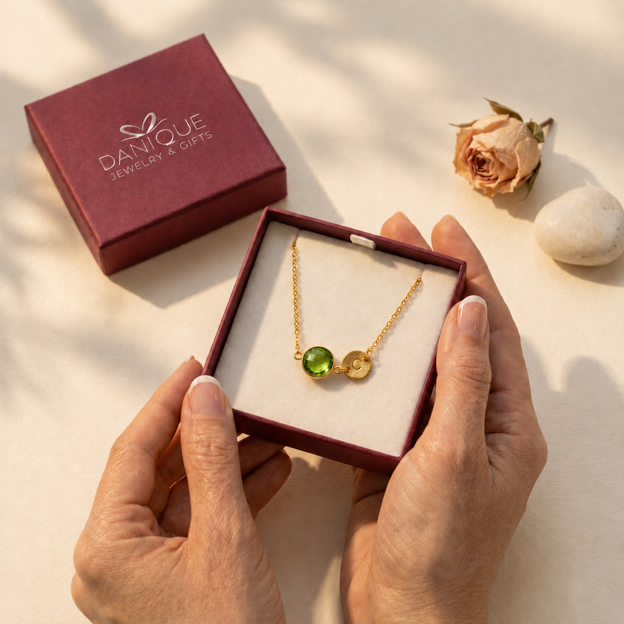 Personalized peridot bracelet presented inside a Danique Jewelry gift box.