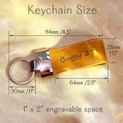 Yellow leather keychain with engraved name “Buggy 27,” shown with precise measurements including total length 4.5", key ring diameter 1.1", and engravable area of 1" x 2". Features include stitched edges and polished metal hardware. Great for custom text, gamer tags, initials, or team names. Compact and durable design ideal for backpacks, luggage, gym bags, or school keys. Personalized key tag for sports teams, kids’ gifts, daily use, or small business branding. Makes a vibrant, functional accessory.