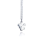Silver puzzle charm necklace with A initial on white background. sterling silver or vermeil gold, each charm features a single engraved initial. Whether it’s for your other half, your lifelong best friend, or a bond between mother and child, this necklace makes a meaningful gift for Christmas, Mother’s Day, or Valentine’s Day. layering necklace, puzzle piece, bff jewelry, couples jewelry, bff necklace, couples necklace