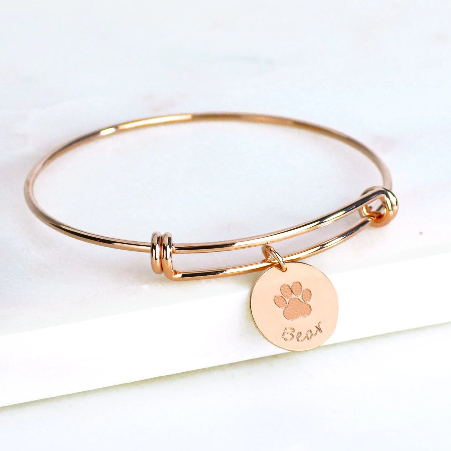 Rose gold filled bangle with paw print and name engraved disc charm