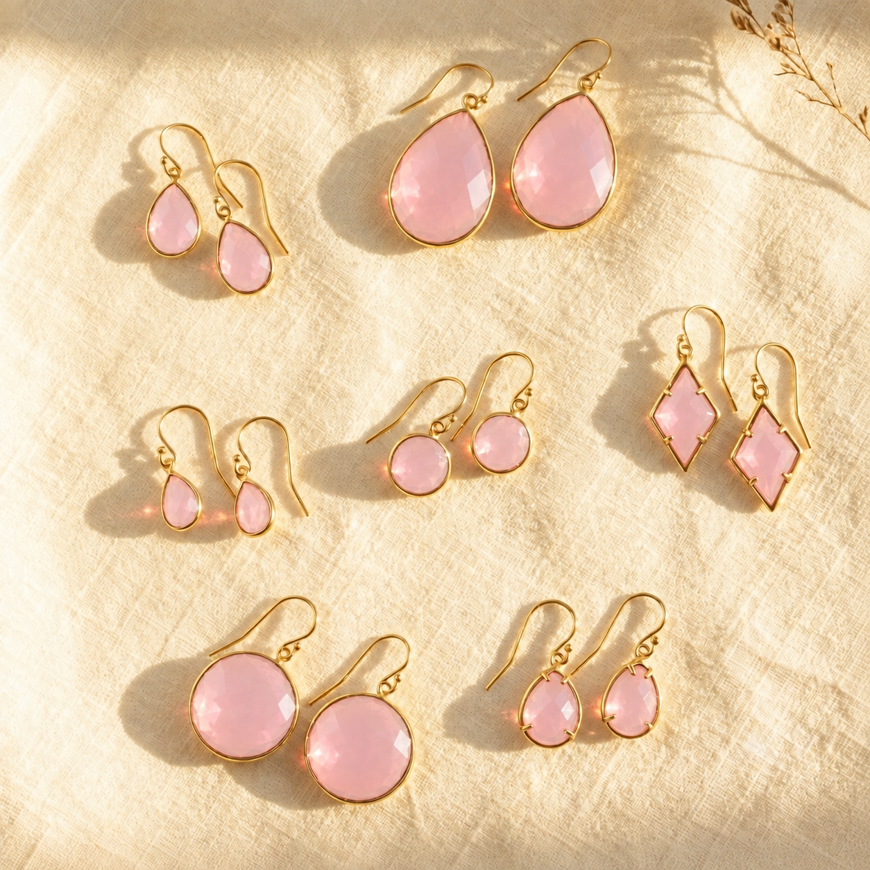 Pink Chalcedony earrings in multiple teardrop, round and prong-set gemstone shapes in gold.
