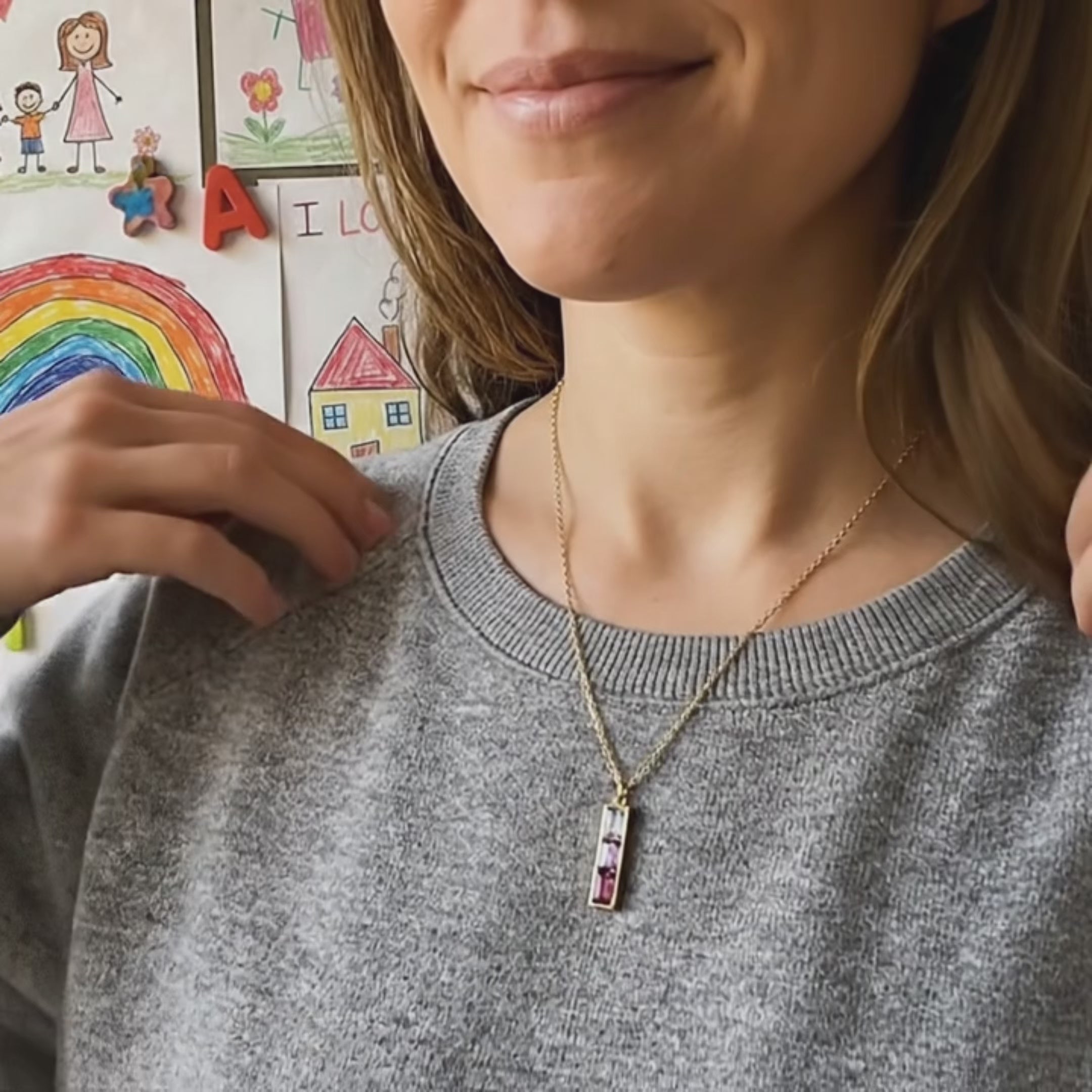 Woman wearing personalized birthstone bar necklace for mom – minimalist vertical family birthstone necklace with colorful gemstones