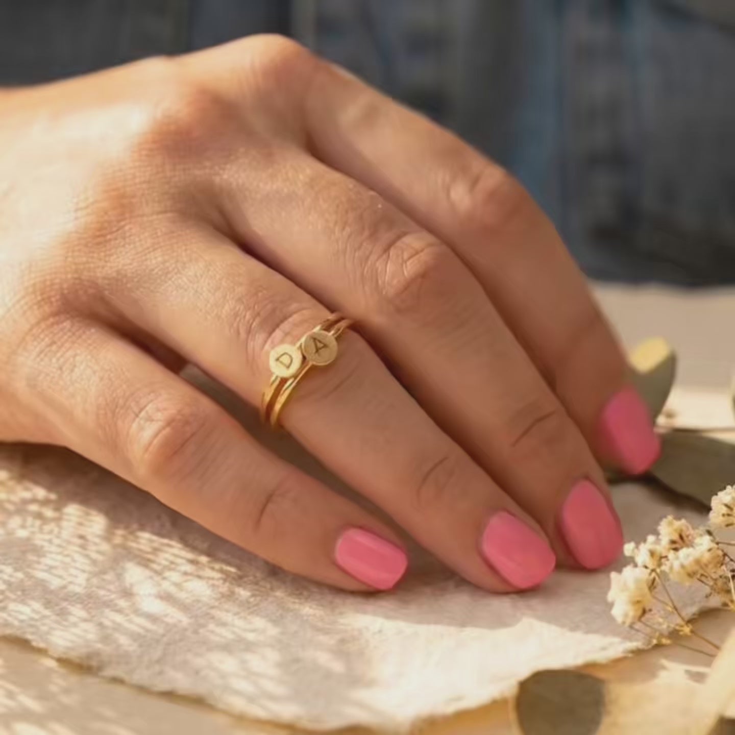 Video showing a personalized initial engraved ring with a dainty polished band, custom letter detail, and meaningful minimalist jewelry style for everyday wear or gifting.