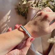 Video featuring a custom engraved leather cuff bangle bracelet handcrafted from genuine natural leather. Personalized with initials, coordinates, or a special message, this unique bracelet makes a thoughtful gift for men or women for anniversaries, Christmas, or Father’s Day.