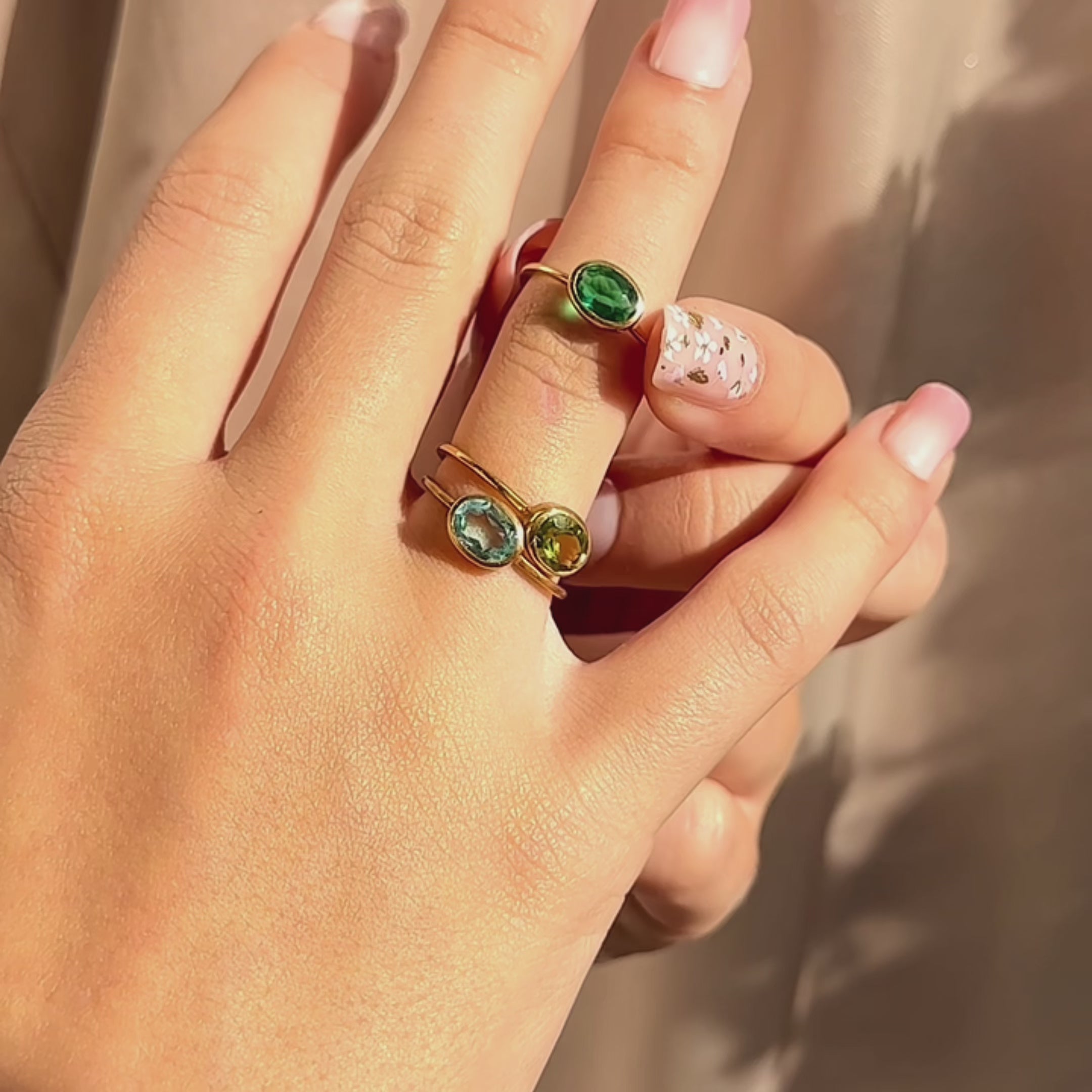 Stackable birthstone oval rings sparkling in sunlight—dainty bezel-set gemstones on slim gold bands for easy stacking. Minimalist oval birthstone rings, available in sterling silver, gold filled, or rose gold filled; hypoallergenic, nickel-free, handmade. Perfect family ring set or mom ring with multiple stones, personalized gift for her for birthday, anniversary, Christmas, Mother’s Day, bridesmaid, or graduation. Trendy stacking rings for everyday wear and layering, adjustable sizing options.