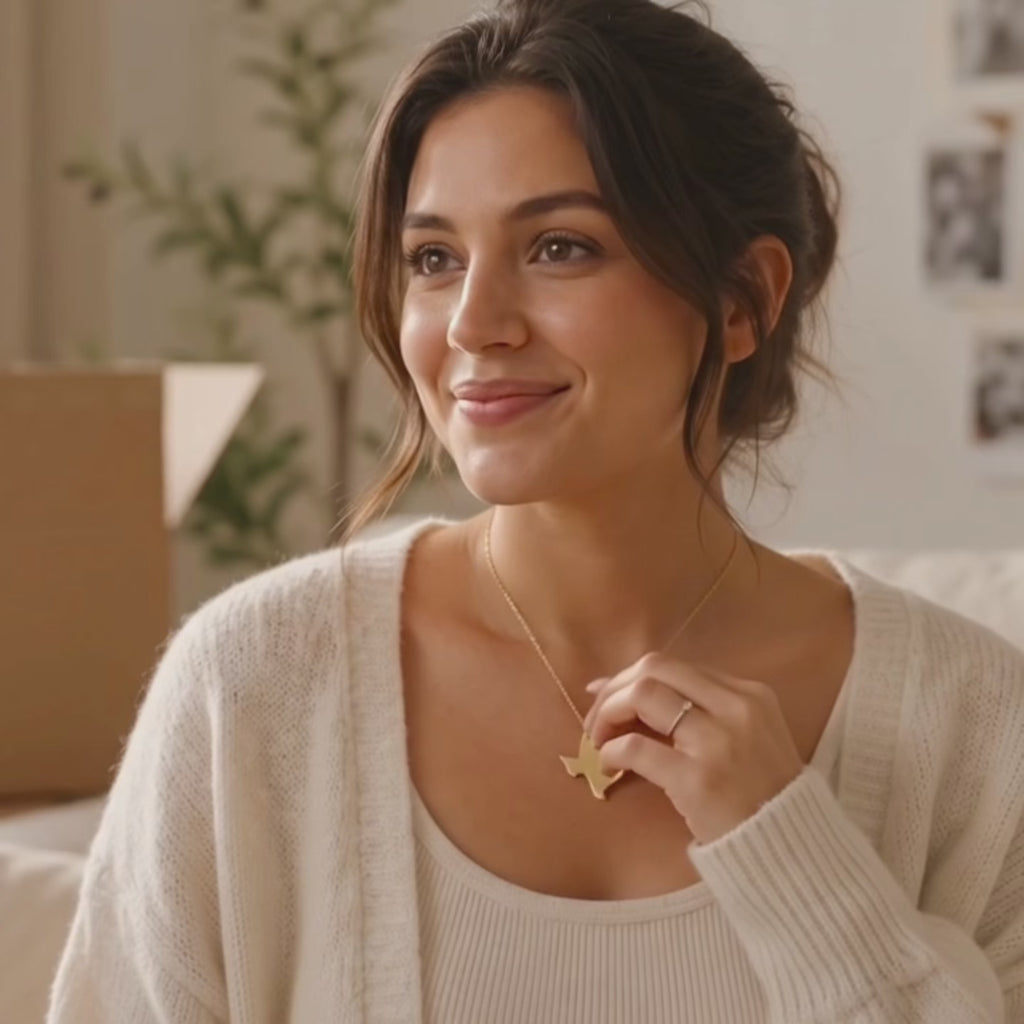 A video showcasing a custom state-shaped necklace with heart location marker