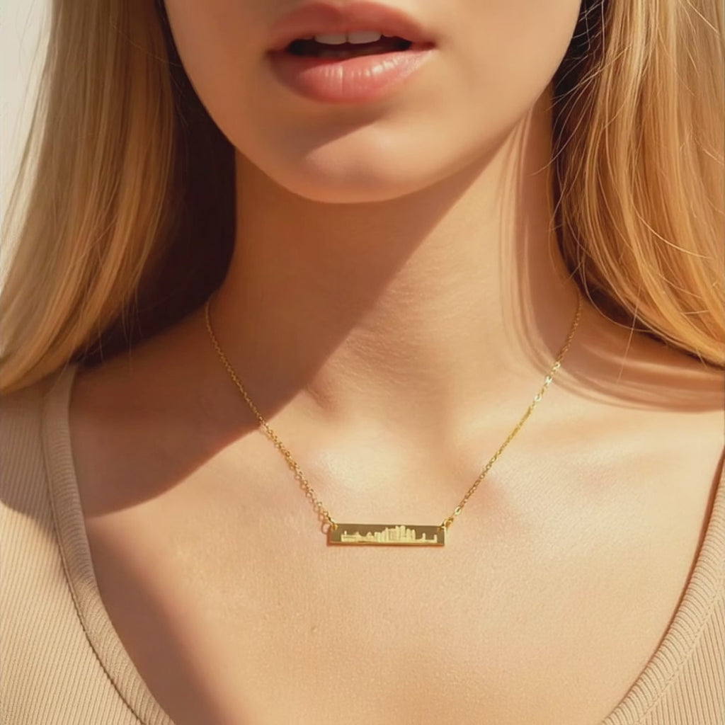 Product video showcasing custom skyline bar necklace with engraved city silhouette, personalized horizontal bar pendant for travel lovers, meaningful city skyline jewelry gift for her