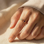 Video showcasing a dainty adjustable birthstone ring with two natural gemstones, elegant stacking ring for everyday wear and personalized jewelry styling