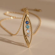 a video showcasing Custom marquise birthstone necklace with up to 5 tiny gemstones in gold, personalized family necklace for mom or loved one