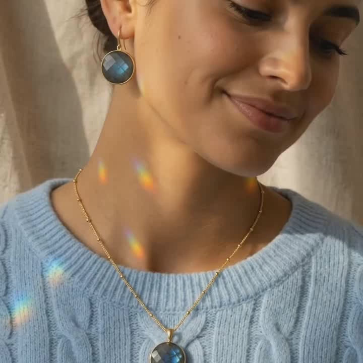 A video showcasing Natural labradorite necklaces in large and small round and teardrop pendant styles on silver, yellow gold, and rose gold chains.