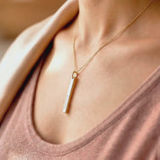 Video showcasing custom engraved dainty 3D bar necklace in gold, featuring a personalized vertical bar pendant with name engraving, modern minimalist style, and delicate chain movement—perfect gift for her, mom, bridesmaids, or anniversary.