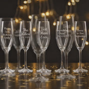 Video showcasing custom engraved champagne glass, personalized wedding toasting flute with name and date, bridal party and couple gift idea, elegant etched champagne flute for bride, groom, bridesmaids, anniversary or celebration.