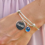 Video showcasing birthstone AND NAME ENGRAVED DISC charm bangle bracelet personalized for mom or grandma
