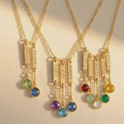 A video showcasing a Custom engraved name bar necklace with birthstone charms for mom or grandma representing her kids or grandkids