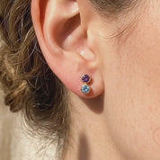 A video showcasing Custom birthstone bar stud earrings with one, two, and three gemstone options in 18K yellow gold, shown on soft fabric with natural shadows for a dainty personalized jewelry look.
