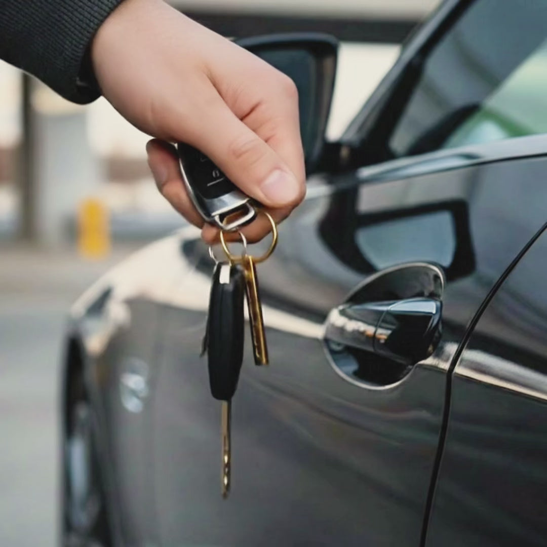 video showcasing a Custom 3D bar keychain engraved with coordinates and meaningful phrases, available in stainless steel, gold tone and black finishes for men and women.