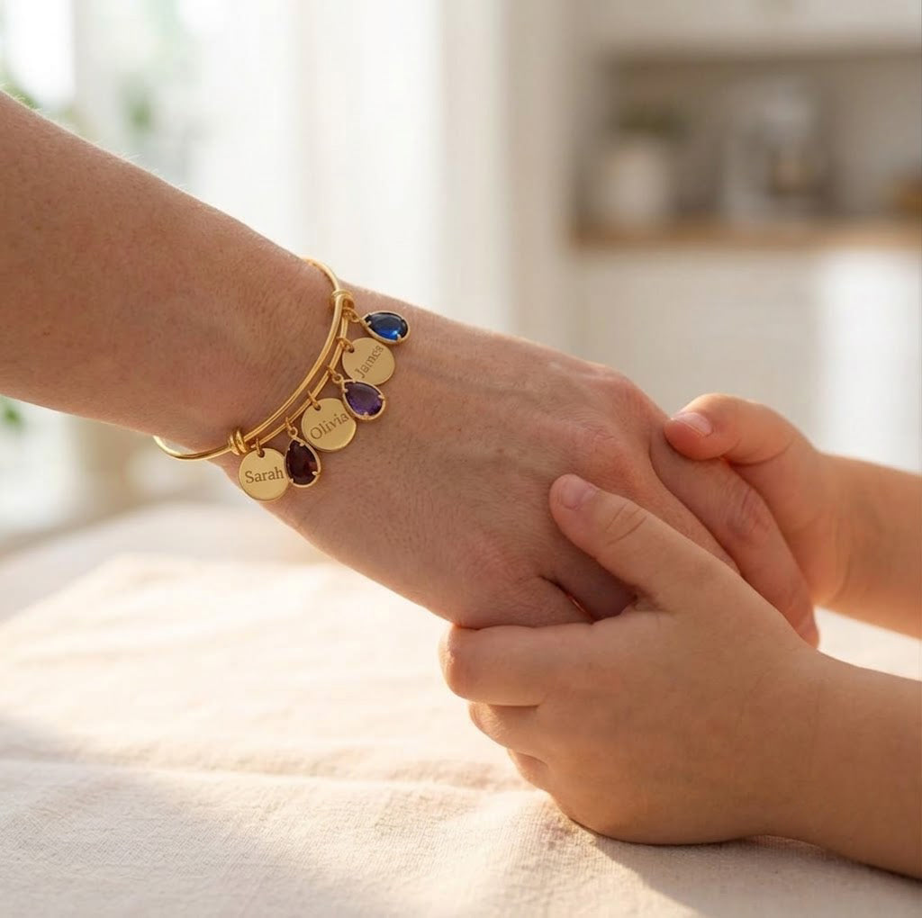 Mom birthstone bangle bracelet worn while holding child’s hand
