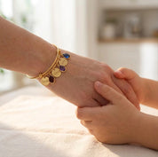 Mom birthstone bangle bracelet worn while holding child’s hand
