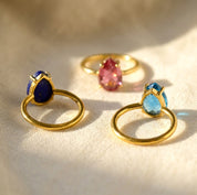 Teardrop stone birthstone chart for custom gemstone rings, showing monthly birthstone options for personalized ring gifts.
