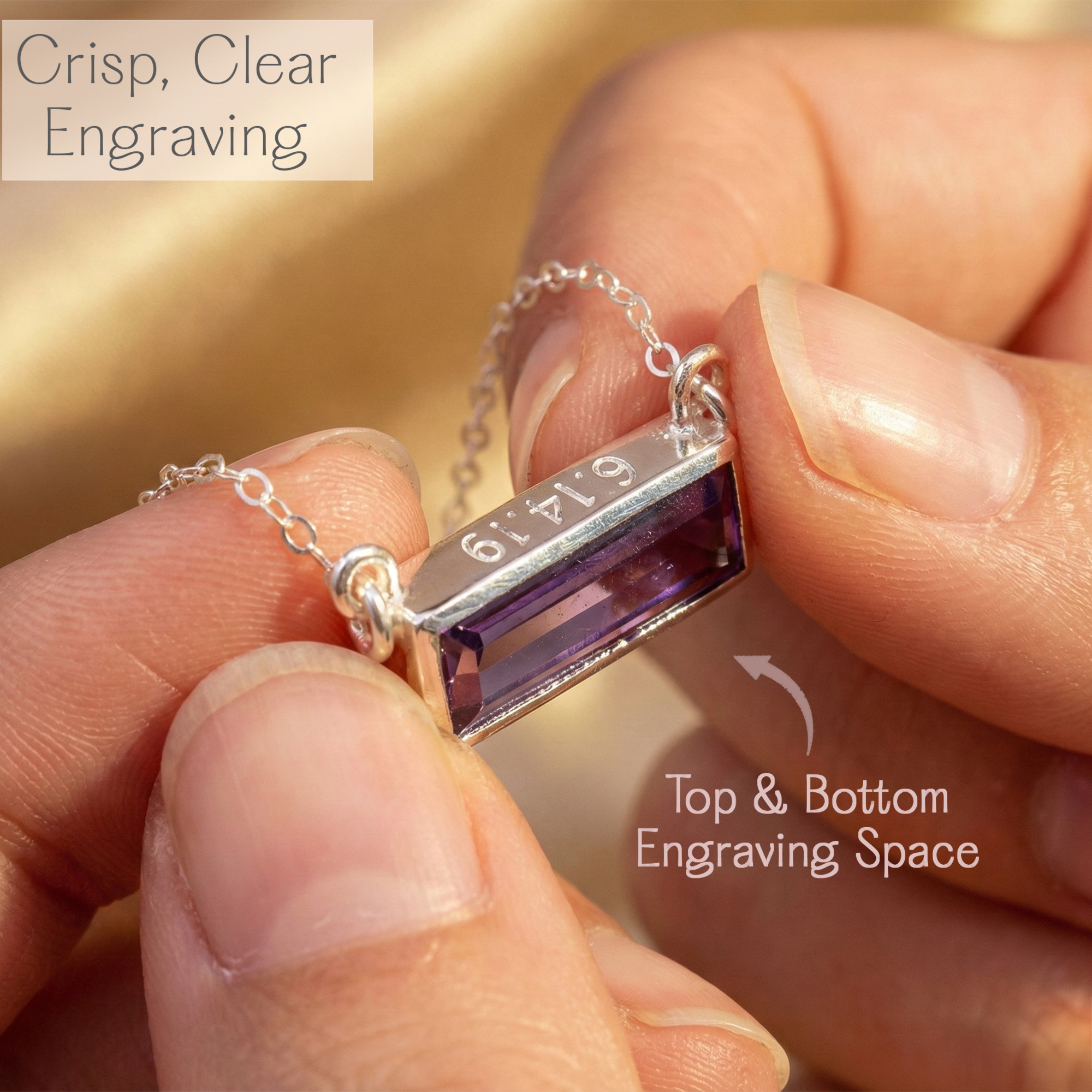 Close-up of sterling silver birthstone bar necklace showing crisp top and bottom engraving with purple amethyst stone