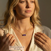 Amethyst birthstone bar necklace worn on model, minimalist gold necklace sitting at the collarbone