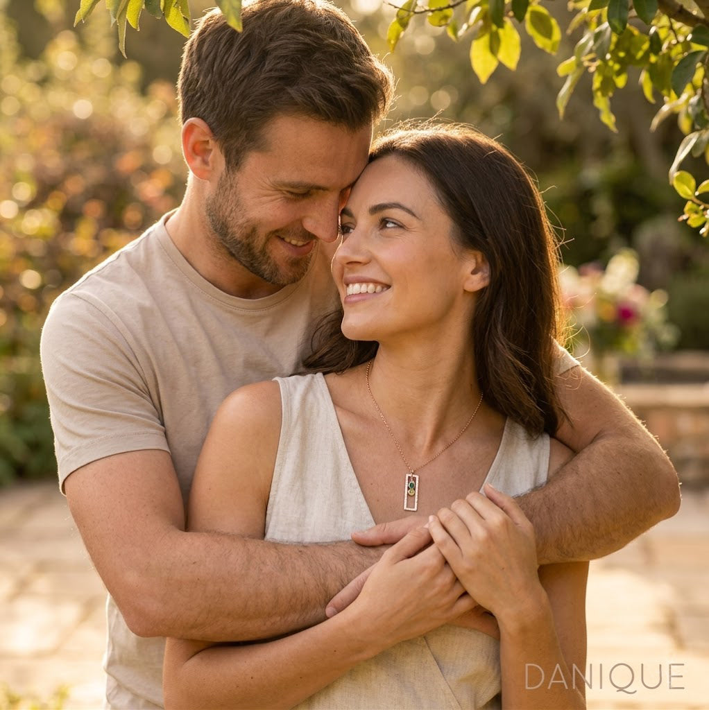 Couple wearing personalized birthstone jewelry, custom vertical birthstone necklace for wife, anniversary, or meaningful family gift.