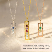Vertical birthstone necklace available in sterling silver, yellow gold, and rose gold finishes with up to five custom stones.