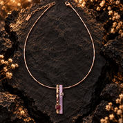 Full Lavender Burgundy geometric pendant necklace with adjustable rose gold chain on dark stone

