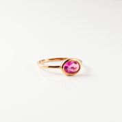 a rose gold ruby quartz ring shown on white background. stackable! Stacking rings, bezel set, small oval, tiny oval, dainty oval, birthstone rings, birthstone ring, birthstone jewelry, red gemstone, red birthstone, july birthstone, july gemstone, stack set, stacking rings, gemstone ring, birthstone ring, mother's day gift for her, gift for mom, gift for fiance, gift for girlfriend, wedding jewelry, bridesmaid jewelry, anniversary jewelry, birthday gift, christmas gift, valentine's day gift