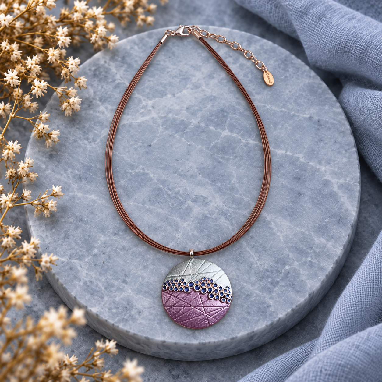 Full boho bubble mosaic pendant necklace with purple teal and silver design on gray stone

