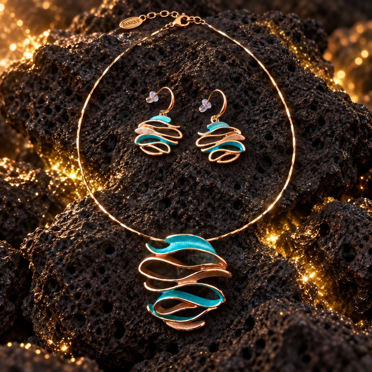 Ocean Breeze Sculptural Wave necklace and matching earrings with teal and warm metallic flowing curves on dark stone


