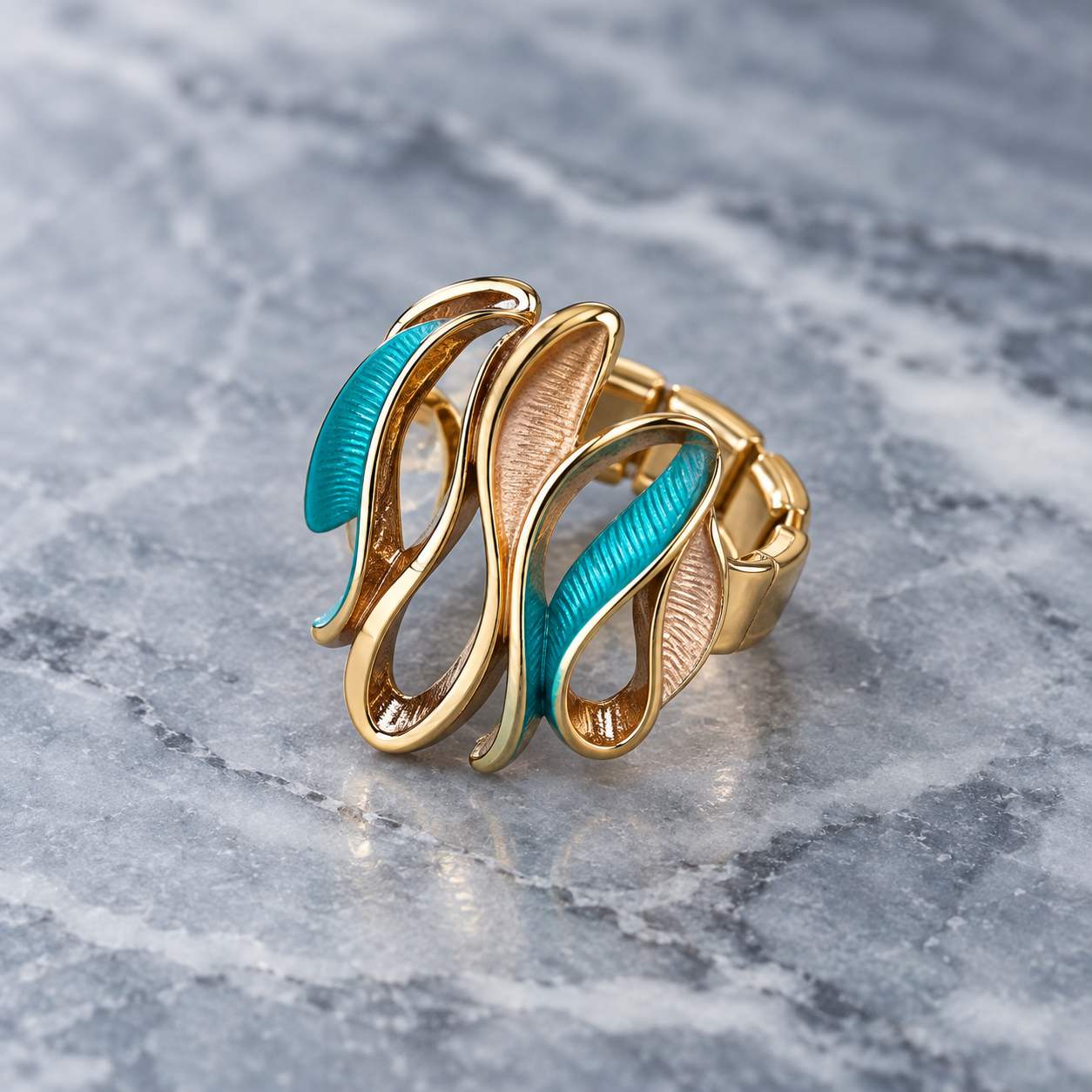Ocean Breeze Sculptural Wave adjustable ring with teal and warm metallic flowing curves on gray stone
