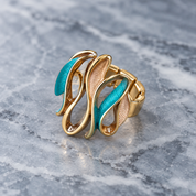 Woman wearing Ocean Breeze Sculptural Wave necklace earrings and coordinating ring