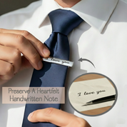 Custom engraved tie clip shown with preserved handwritten note engraving, demonstrating how personal handwriting is transferred onto a sleek metal tie bar. Meaningful personalized gift for men, perfect for weddings, memorial keepsakes, anniversary gifts, and sentimental moments.