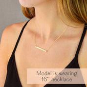 Morse code bar necklace worn showing 16 inch chain length on model. Minimalist skinny bar necklace with engraved hidden message, designed for layering or everyday wear. Custom morse code necklace in gold filled.