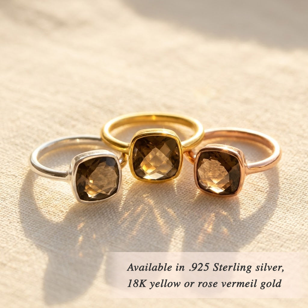 Cushion smoky quartz ring styled with layered gemstone rings on hand