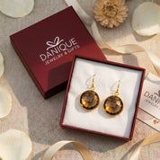 Large round Smoky Quartz earrings displayed in Danique Jewelry signature gift-ready packaging.