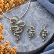 Natural Sage Ribbon Cascade necklace and matching earrings displayed together on gray stone