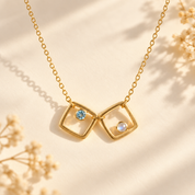 Personalized square birthstone necklace with two gold pendants and tiny gemstones