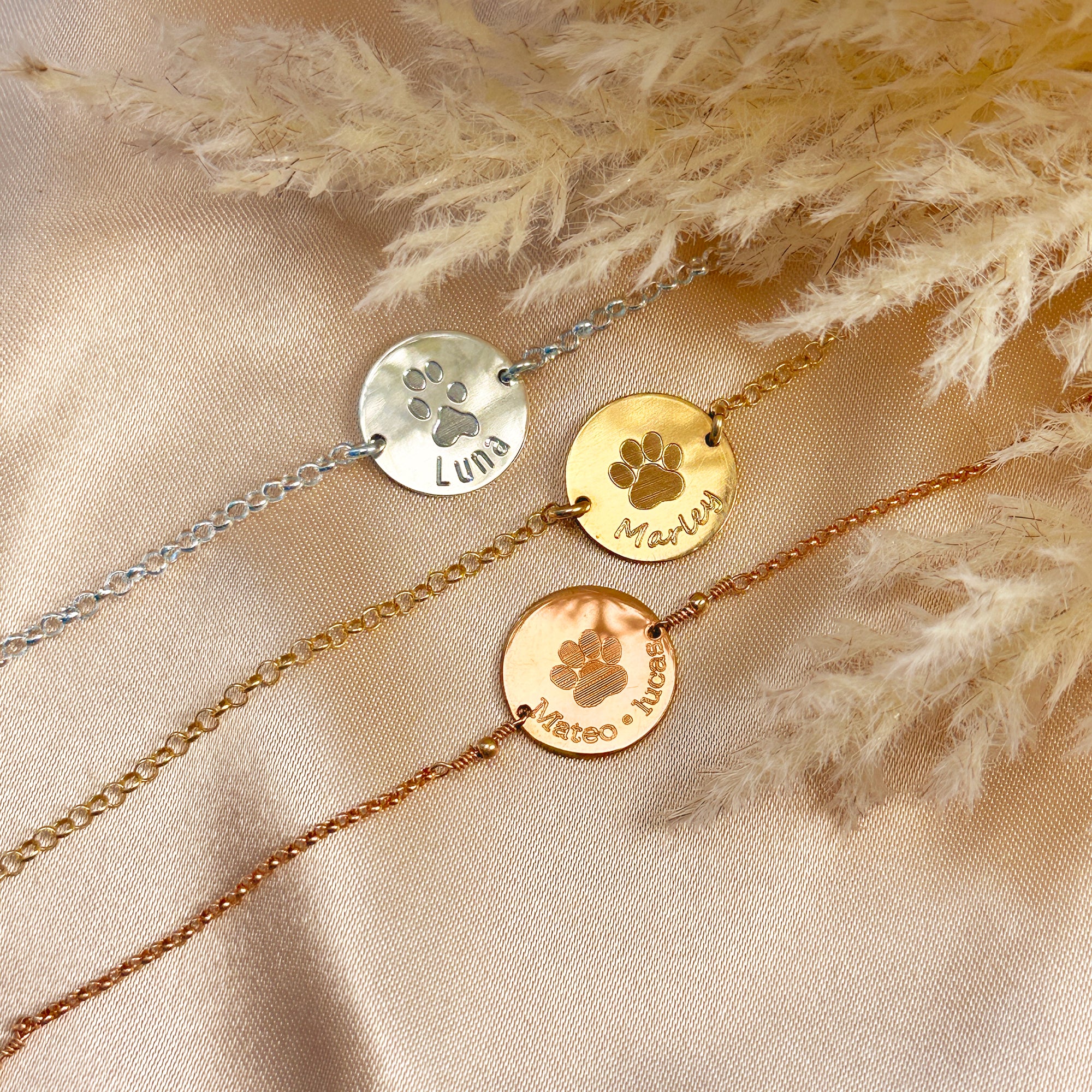 Sterling silver, gold, and rose gold bar bracelets engraved with custom paw prints and pet names, personalized pet memorial jewelry for dog or cat lovers, meaningful remembrance gift with adjustable chain options.