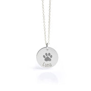 Sterling silver disc pendant necklace engraved with a detailed dog paw print and the name “Luna,” personalized pet remembrance jewelry, custom pet loss sympathy gift for dog or cat owners, unique keepsake necklace with minimalist design, available in multiple chain lengths for everyday wear or special occasions.