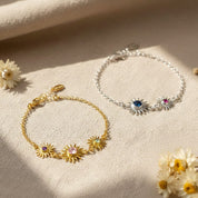 Collection of custom sunburst birthstone bracelets with various gemstone colors and metal finishes. Personalized family jewelry designed for moms and grandmas.