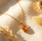 Sunstone cabochon necklace in gold with natural orange gemstone pendant