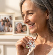grandmother wearing personalized family tree necklace with birthstones and name charms