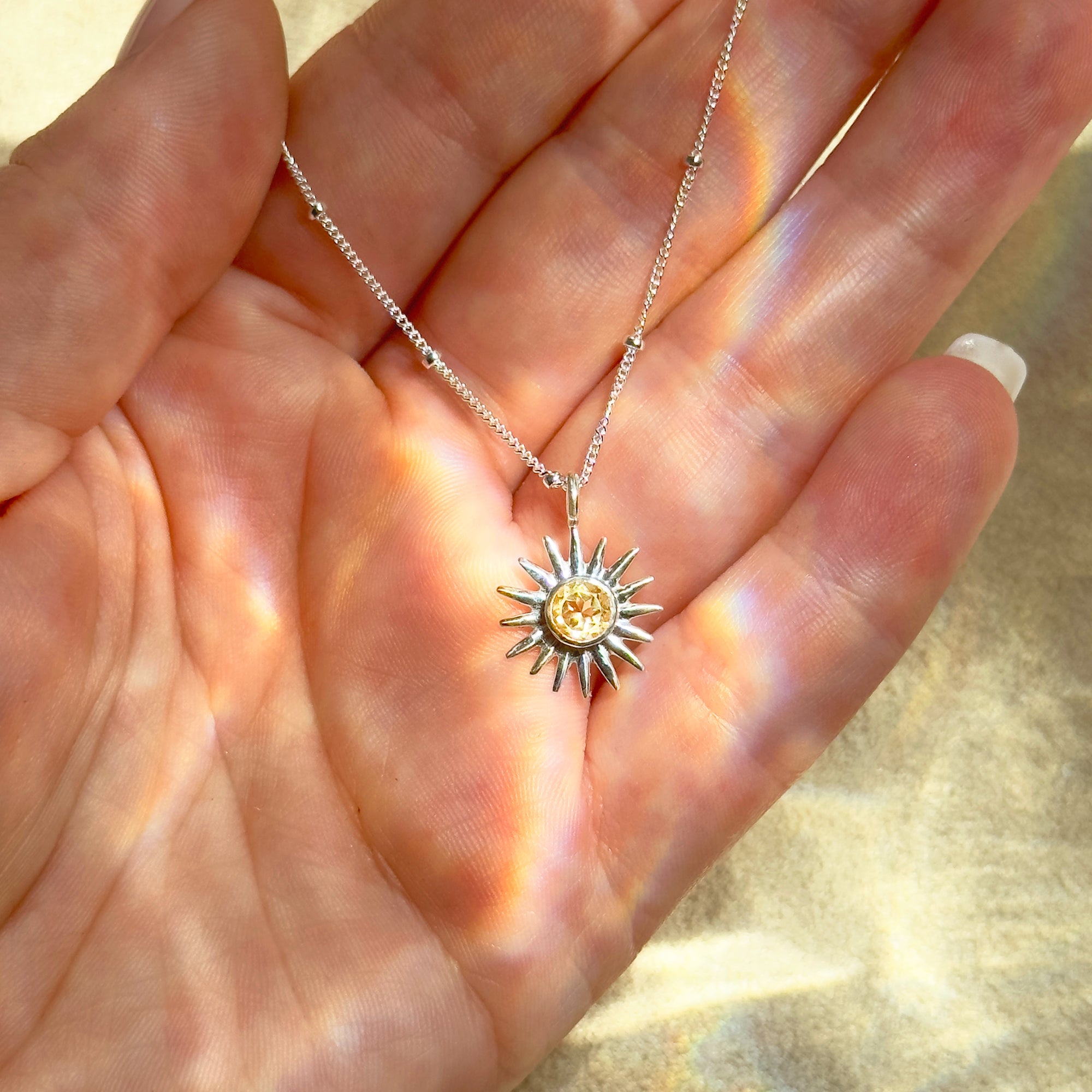 Sterling silver sunburst birthstone necklace featuring citrine November stone. Personalized zodiac jewelry perfect for daughters, girlfriends, or bridesmaid gifts.