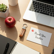 Personalized leather keychain styled on a desk with laptop and thank you card, thoughtful gift for teacher or coworker