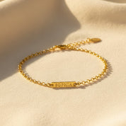 tiny bar bracelet in 18k gold vermeil displayed on soft neutral fabric, featuring a slim rectangular bar engraved with the name Sophia in a delicate uppercase font, attached to a dainty chain with small bead accents, customizable with initials, names or dates, available in multiple font options and adjustable or fixed lengths, minimalist personalized bracelet perfect for everyday wear, bridesmaid gifts, birthdays or meaningful monogram jewelry for women